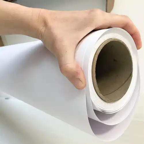 Close-up of a smooth, printable roll of MG bleached kraft paper