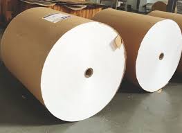 A stack of printed folding cartons made from duplex board